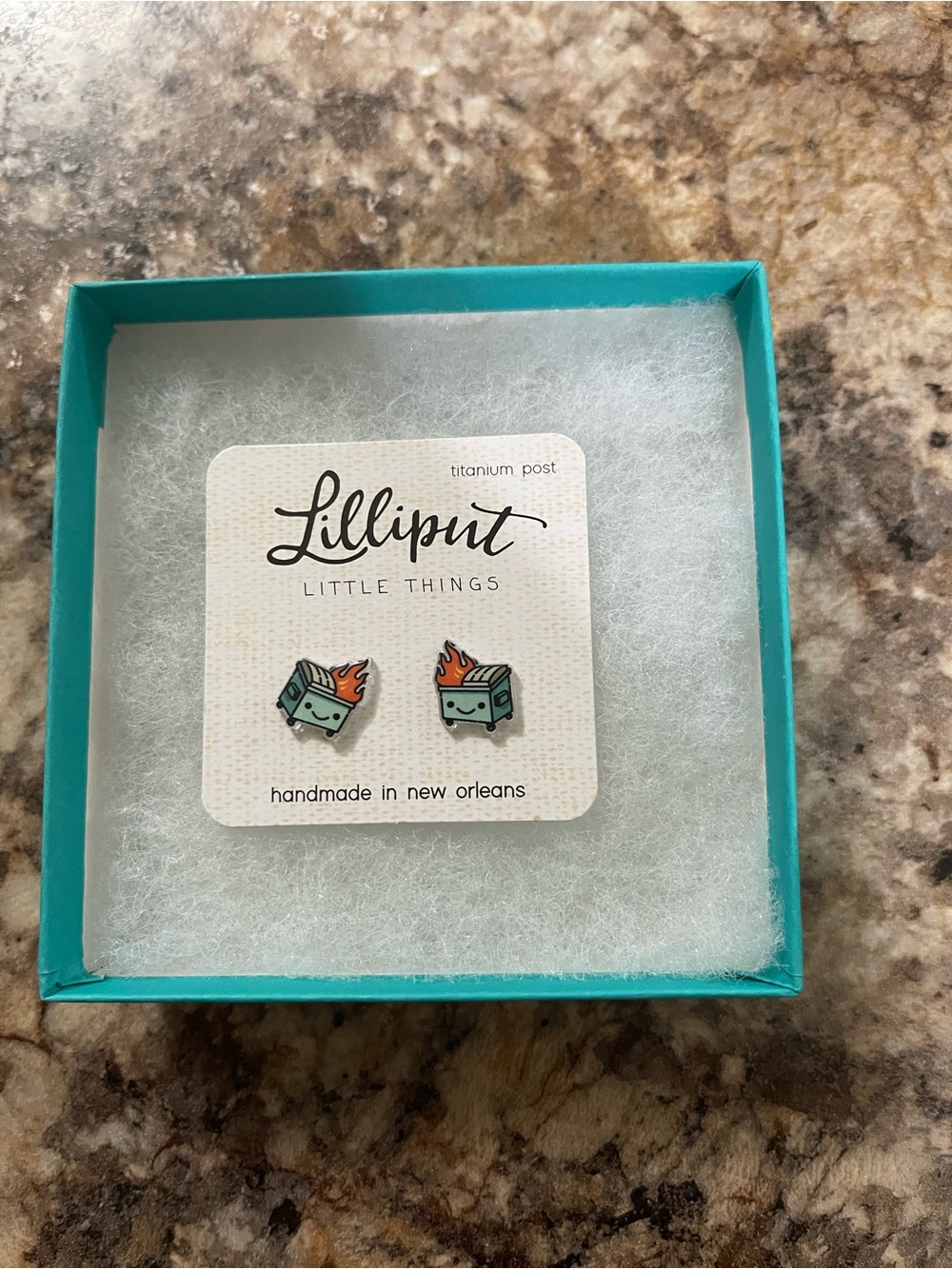 Titanium teal dumpster fire enamel stud earrings with orange flames